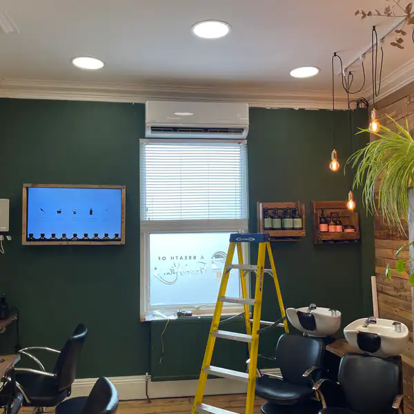 Wall-mounted air conditioning installed in a hair salon in Bristol