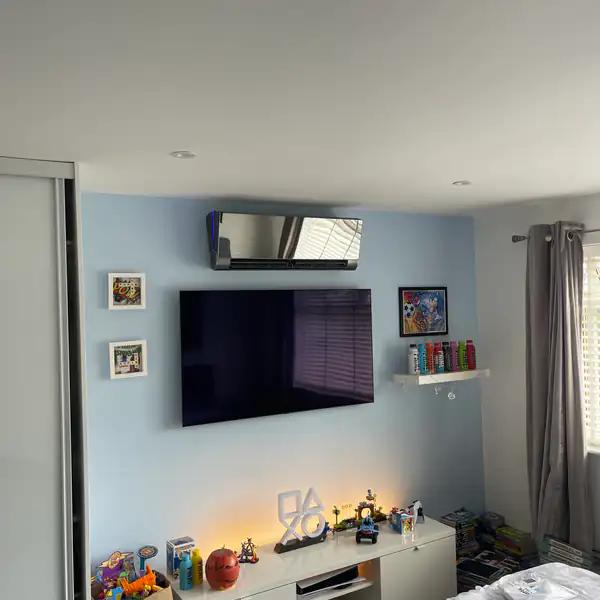 Wall-mounted air conditioning unit in a family living room in Bristol