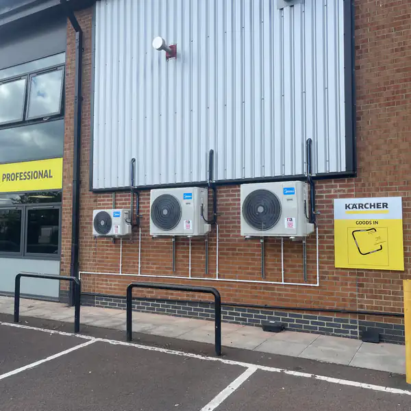 Outdoor air conditioning condensers installed on a retail unit in Bristol
